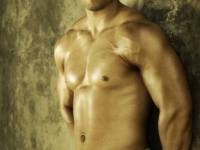 bigstockphoto_Young_Bodybuilder_Against_Wall_3847850