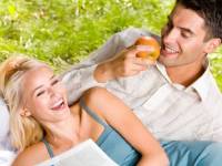 bigstockphoto_Young_Happy_Couple_Eating_Appl_2286263
